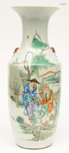 A Chinese polychrome vase decorated with figures in a landscape, H 58,5 cm