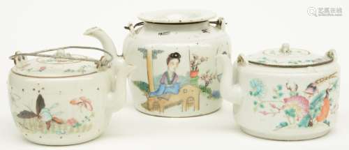 Three Chinese teapots, polychrome and famille rose decorated, marked, ca. 1900, H 9,5 - 12 cm (chips on the rim and some with restorations and minor damage on the handles)