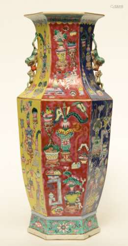 A Chinese polychrome ground famille rose hexagonal vase, decorated with antiquities, H 57,5 cm (chips on the rim)