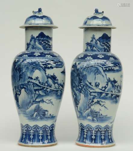 A pair of Chinese blue and white baluster shaped vases with cover, overall decorated with a river landscape, 19thC, H 64,5 cm (the covers with chips and firing faults)