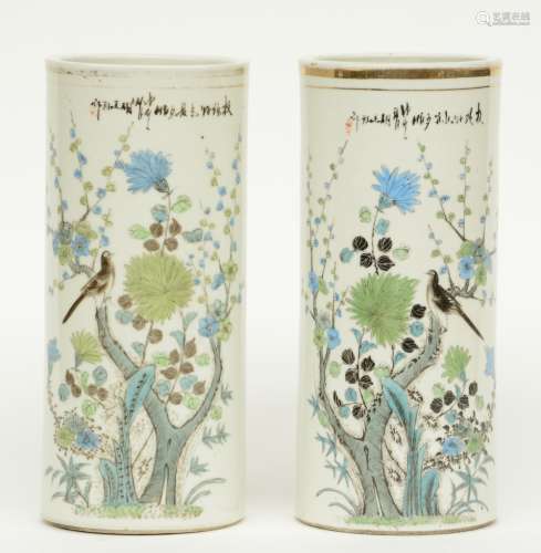 A pair of Chinese cylinder shaped vases, polychrome decorated with a bird and flower branches, marked, H 28 cm