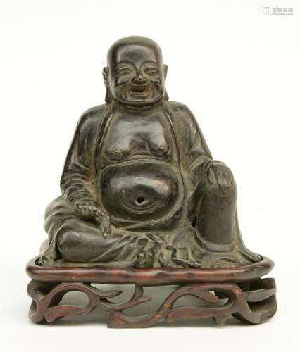 A Chinese bronze Budai on matching wooden stand, probably Ming, H 14 cm (with base) (perforations)