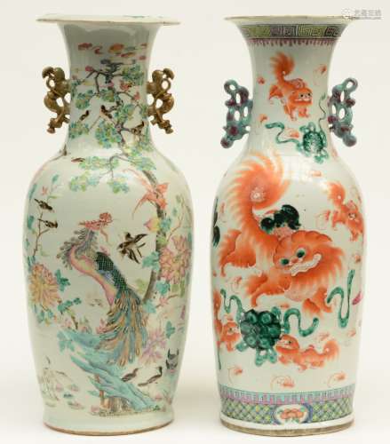 Two Chinese polychrome vases, decorated on both sides, 19thC, H 61 - 61,5 cm (chips on the rim - one vase with a crack in the bottom)