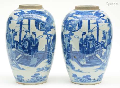 A pair of Chinese blue and white vases, decorated with an animated garden scene, 19thC, H 34 cm (firing faults)