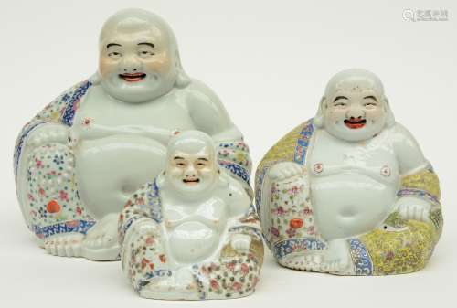 Three Chinese polychrome laughing Buddai, marked, ca 1900, H 14,5 - 25,5 cm (firing fault and flaking of the glaze)