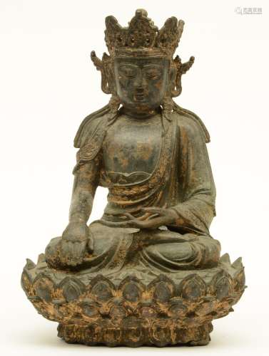 A Chinese bronze seated Buddha, traces of polychromy and gilt, H 37 cm (perforation on the knee, restoration on the bottom rim)