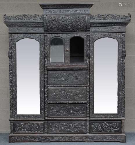 An Impressive Chinese hardwood display cabinet, richly carved with dragons and floral motives, 19thC, H 228 - D 69 - L 206 cm (minor damage)
