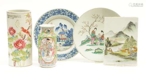 A Chinese hat stand, vase and two plates, famille rose and polychrome decorated, 18th - 19thC; added a polychrome decorated Chinese plaque with a river landscape, H 22 - 29 - Diameter 29 - 30 cm; 17,5x25,5 cm (one plate with hairline, vase with chips to the rim)