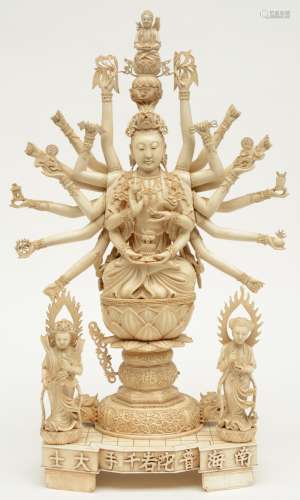 A Chinese ivory 100-armed seated Guanyin and two other goddesses, on a matchting base with calligrapic text, first half 20thC, H 62 - W 37,5 cm (minor damage)