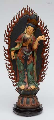 A first half of the 19thC sculpted wooden and ivory Guanyin, H 70,5 cm