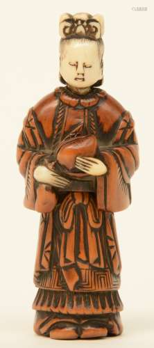 A Japanese early Meiji period  erotic boxwood and bone netsuke depicting a lady, out of two parts, H 8,6cm, Total weight 30g