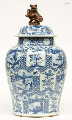 A large Chinese blue and white vase with cover, decorated with flowers and landscapes, Kangxi, H 66 cm (some restoration on the rim)