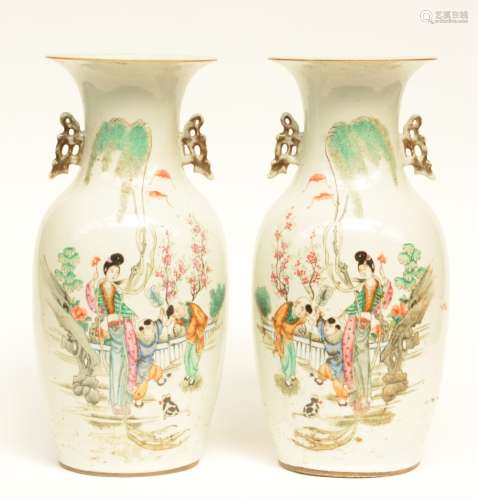 A pair of Chinese polychrome vases, decorated with children playing in a garden, H 43 cm