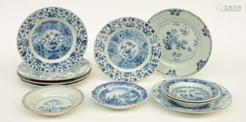 Seven Chinese blue and white dishes decorated with floral motifs, 18thC; added four ditto dishes decorated with gardens and a landscape, Diameter 16 - 23,5 cm (chips on the rim and hairlines)