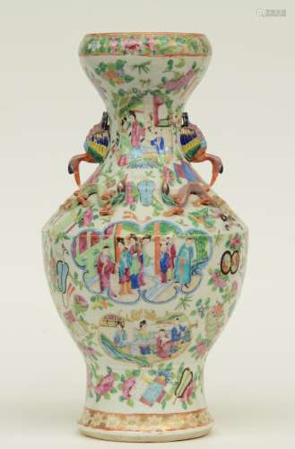 A Chinese famille rose and dragon relief moulded vase, the roundels decorated with animated scenes, the handles moulded with birds, 19thC, H 43 cm (minor hairline only visible from the inside)