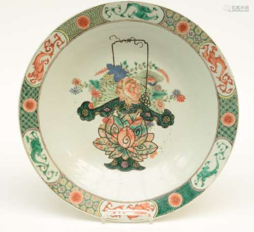 A Chinese famille verte plate, decorated with a flower basket, 19thC, Diameter 41 cm (some chips on the rim)