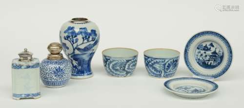 Two Chinese blue and white vases and a tea caddy, floral decorated, with silver mounts, 18th - 19thC; added two ditto saucers and cups, decorated with dragons and a river landscape, H 7 - 16,5 - Diameter 14 cm (chips and hairlines)