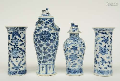 Two Chinese blue and white cylinder shaped vases and two vases and covers, decorated with birds, insects and floral motifs, marked, H 15 - 21 cm (chips on the rim)