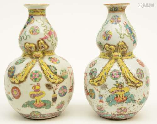 A pair of small Chinese famille rose kalebas vases, decorated with relief and other symbols, 19thC, H 21,5 cm (chips on the rim)