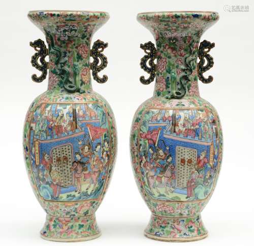 A fine pair of Chinese famille rose baluster-shaped vases, relief moulded, the panels decorated with a court scene and warriors, 19thC, H 63 cm (bot vases with perforation on the bottom, one vase with firing fault on the top rim)