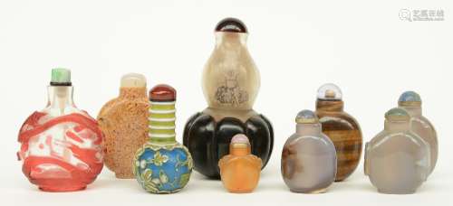Nine Chinese snuff bottles, glas and semi-precious stones, 19thC and 20thC, H 3,5 - 11 cm