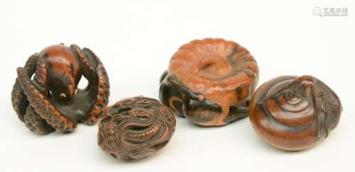 Two Japanese wooden katabori netsuke, one in the form of a pumpkin and three eggplants; the other one in the form of a vineyard snail, both signed and late Edo-period; added a wooden anabori netsuke depicting a dragon playing on weaves; extra added a ditto netsuke depicting an octopus, late Edo-period, W 4,5 - 4,2 - 3,8 - 3,5cm.