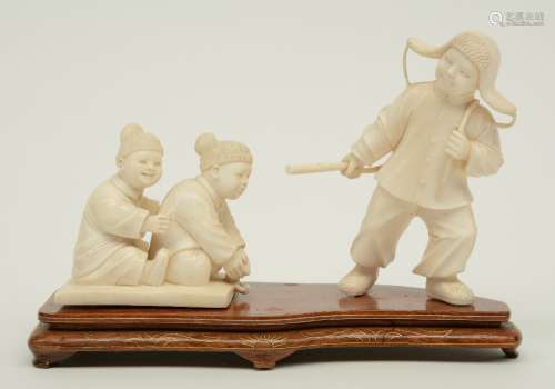 A Chinese ivory group depicting a winter scene with playing children, first half 20thC, H 7,5 - 12,4 cm (without base), Weight: ca. 327 g (without base) (one part missing)