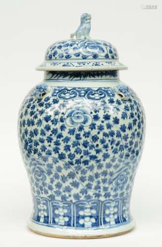 An imposing Chinese blue and white decorated vase and cover, relief moulded, painted with floral motifs, 19thC, H 64 cm (firing faults and a chip on the rim)