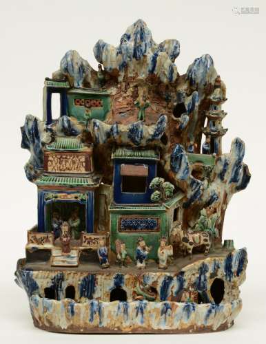 A Chinese doucai earthenware sculpture, depicting the Eight Immortals in their natural habitat, 19thC, H 50,5 - W 38,5 cm (minor damage)