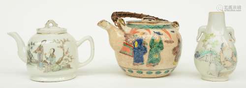 A Chinese polychrome teapot and vase, decorated with figures, marked, 19thC; added a Chinese polychrome stoneware tea pot, H 12 - 13,5 cm (chips)