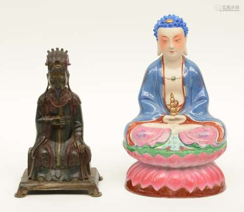 A Chinese bronze Buddha; added a ditto Buddha in polychrome decorated porcelain, ca. 1950, H 24,5 - 30,5 cm