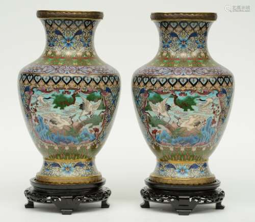 A pair of Chinese cloissoné vases, the panels decorated with cranes, on matching wooden base, H 44,5 (with base) - 39 (without base) cm