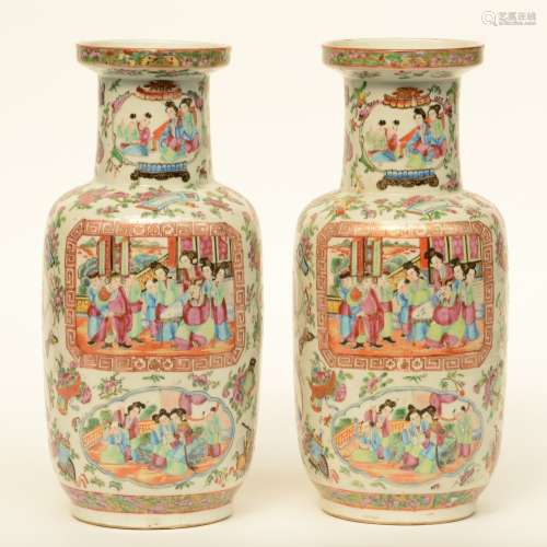 A pair of 19thC Chinese famille rose rouleau vases, the panels painted with courtscenes, H 38,5 cm (crack on the bottom)