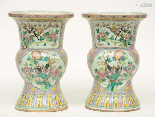 A pair of Chinese famille rose beaker vases, decorated with phoenixes and birds on flower branches, H 33 cm (one vase with crack on the bottom and one vase with cracks on the top rim and on the body)