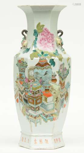 A Chinese hexagonal polychrome vase decorated with vases of flowers and antiquities, relief decoration, 19thC, H 58,5 cm (chips on the rim)