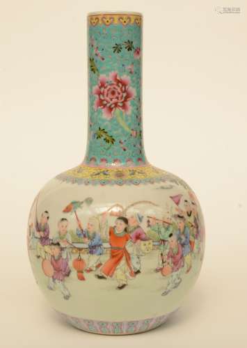 A Chinese famille rose bottle vase decorated with an animated scene with children, marked, H 33,5 cm