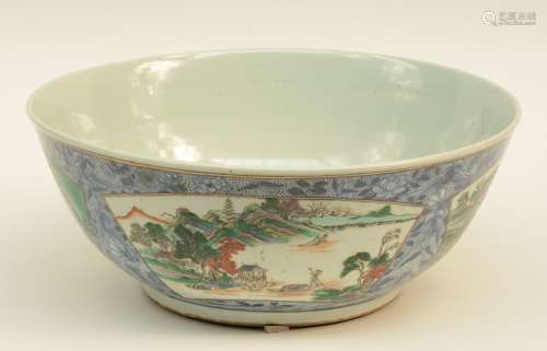 An 19thC Chinese bowl, blue and white decorated ground and with fan shaped famille verte painted reserves and inside, H 15 - Diameter 37 cm