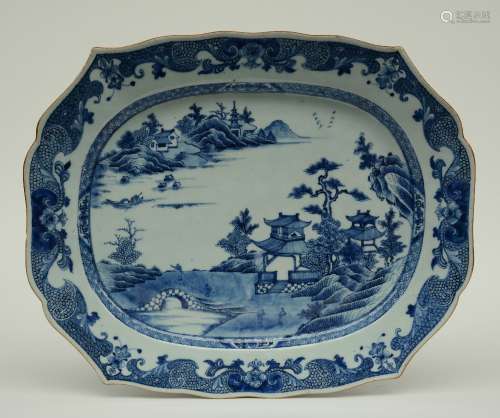 A fine Chinese blue and white plate, decorated with figures in a riverlanscape, 18thC, H 4,5 - W 44,5 - D 36,5 cm (chips on the rim)