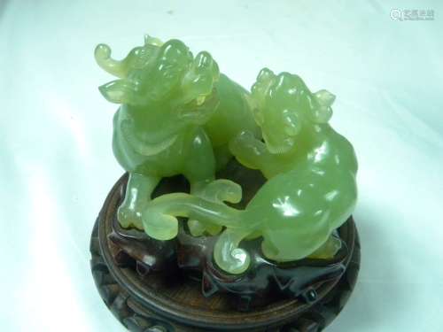 Two Green Jade Animals on wood stand