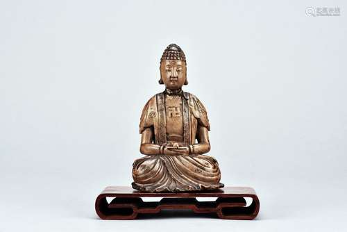 A stone carved figure of buddha