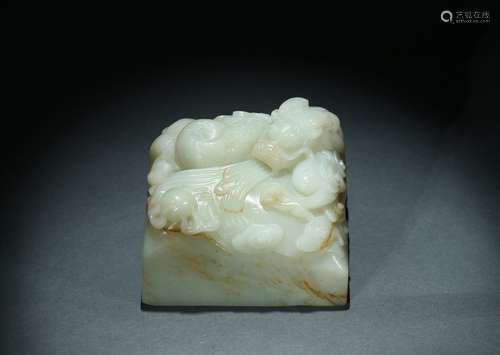 A white jade 'dragon' paper weight