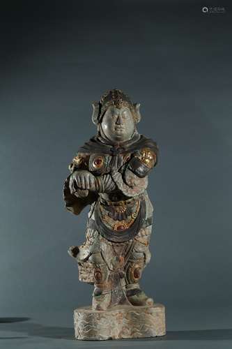 A stone carved gilt inlaid figure of lishi