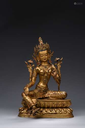 A large gilt-bronze figure of Tara