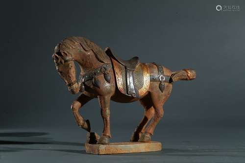 A stone carved gilt silver inlaid horse