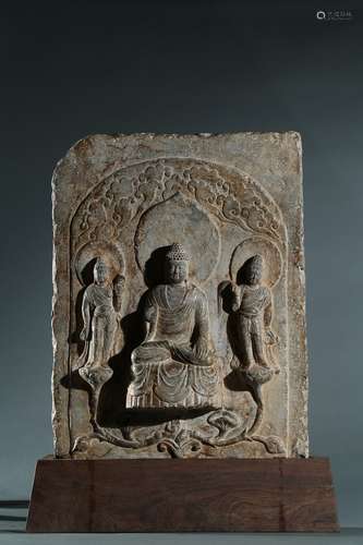 A stone relief panel of shakyamuni and attendants