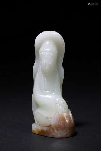 A small white jade carving of Guanyin