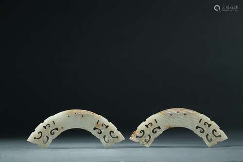 A pair of archaic white jade huang