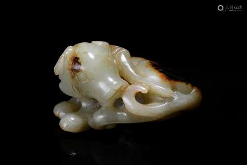 A white and russet jade carving of dog