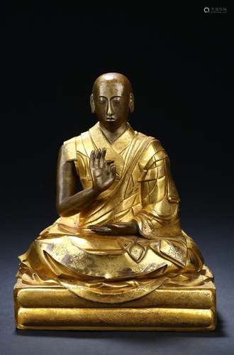 A gilt-bronze figure of the second panchen lama