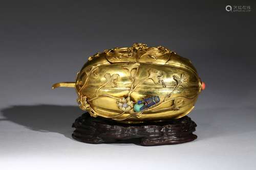 A gilt-bronze gems-inlaid melon-shaped box